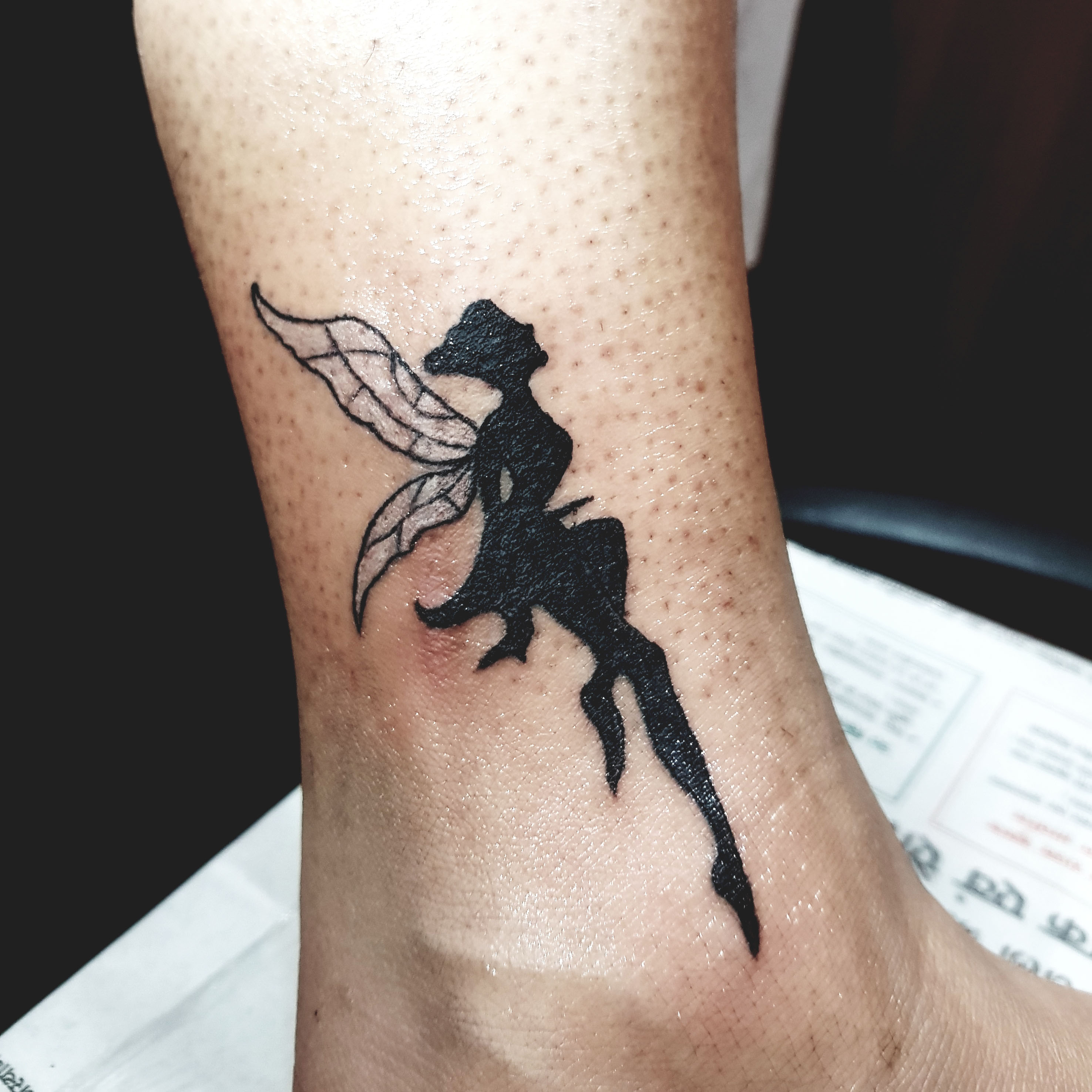 fairy tattoo for ankle, angel on ankle tattoo.