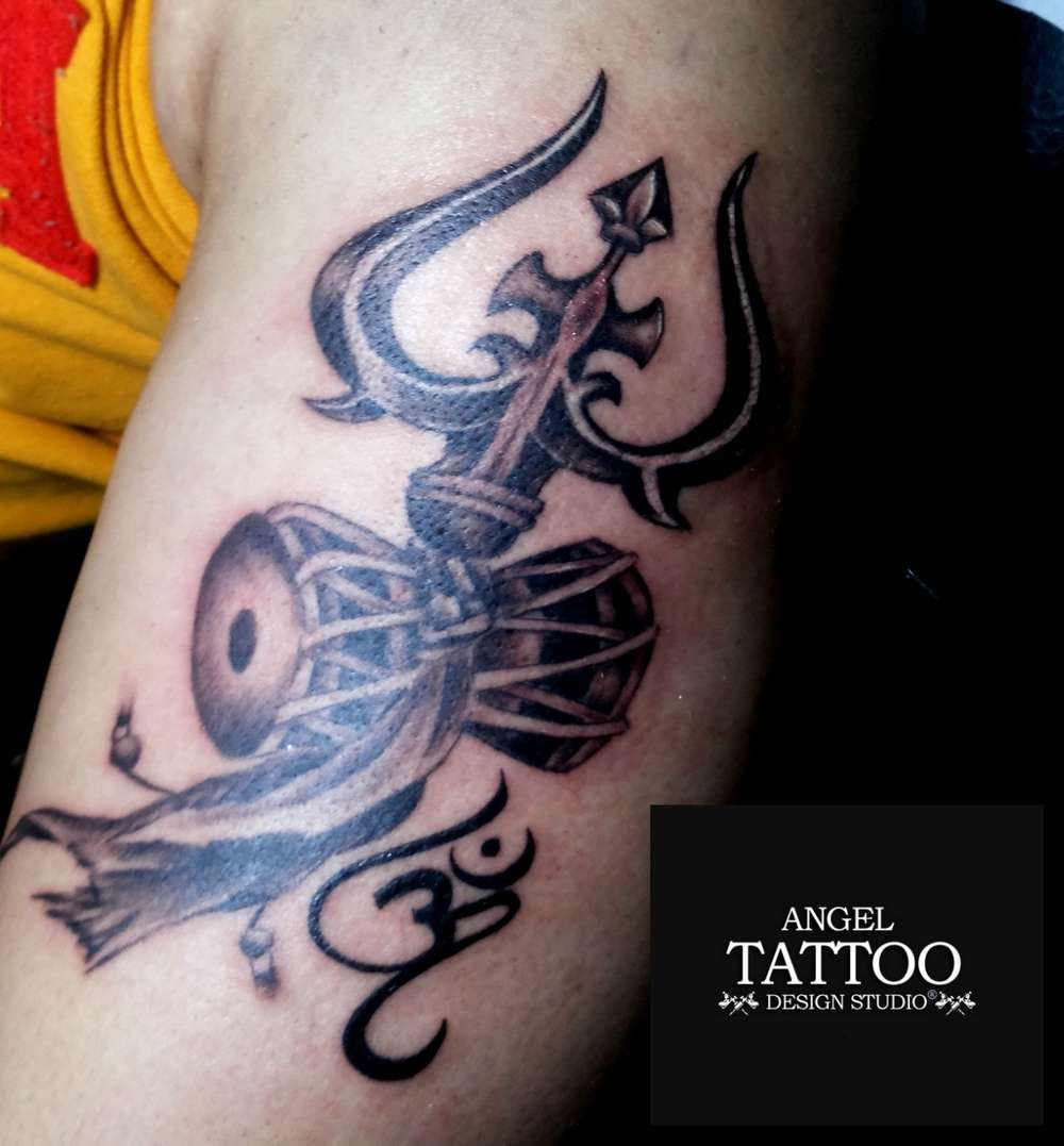 Tattoo Ashram - Trishul with Om Tattoo - Shiva Tattoo Artist:  @rahul_tattooashram Studio: @tattooashram PC: @uncommonmontage To Book your  appointment DM or Call on 8080515151 / 9821444488 #tattooashram  #rahulgaikwad #piercing.rg #piercing #septumpiercing #